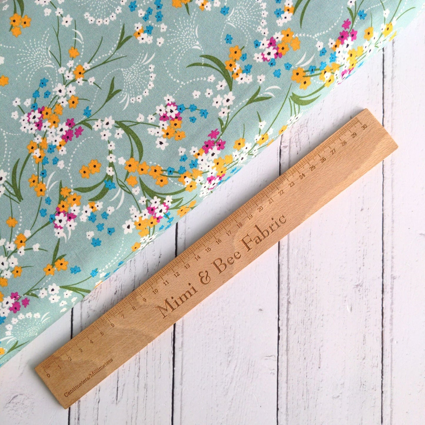 fabric Light green floral viscose dressmaking fabric