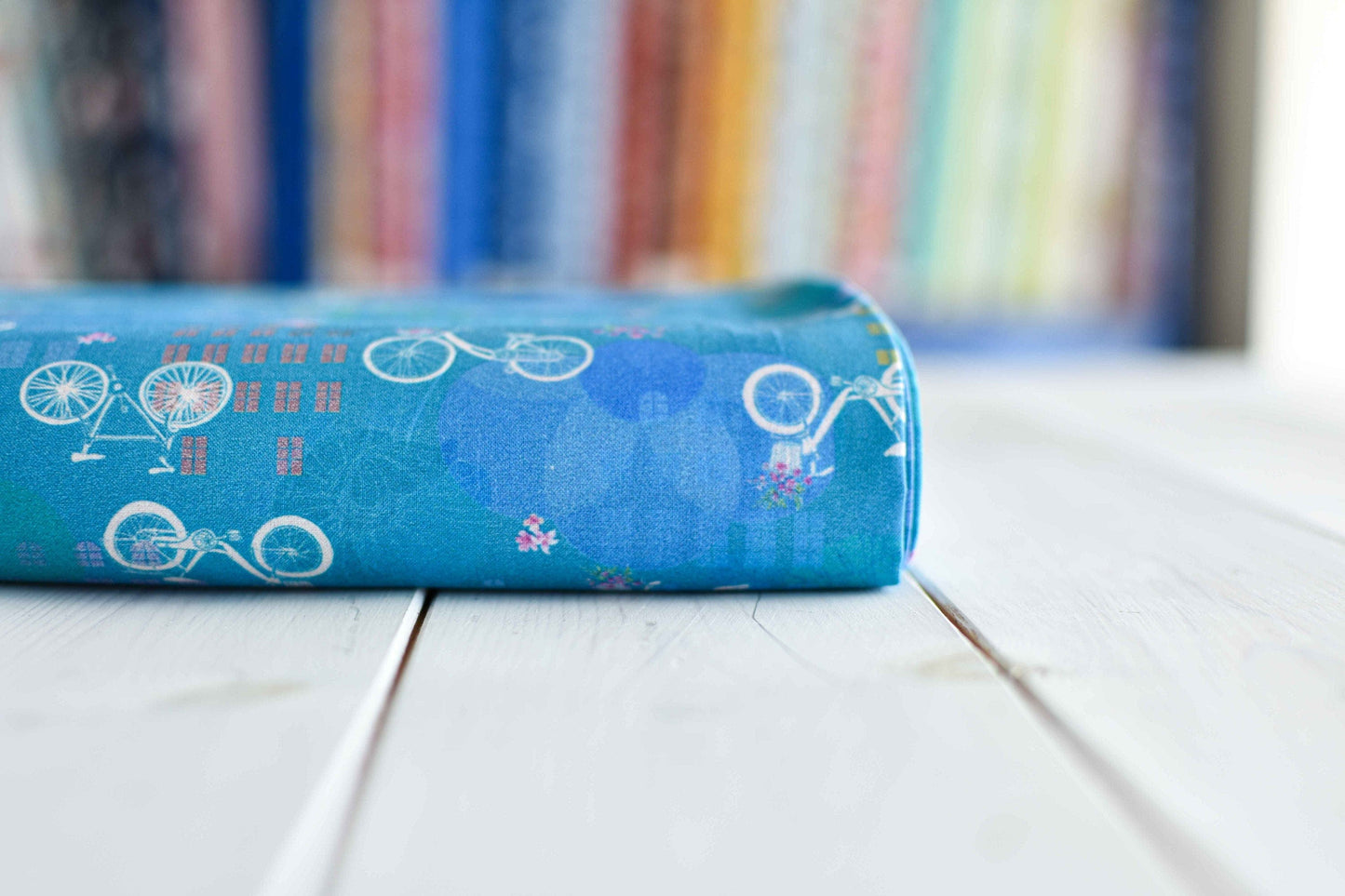 Fabric Bicycles on blue cotton fabric - Robert Kaufman