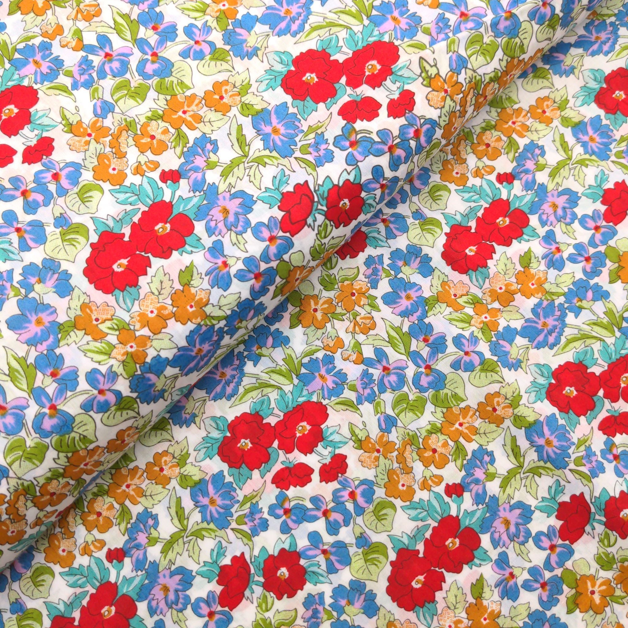 Cotton lawn fabric with red, blue and yellow flowers - Peter Horton