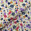 Navy and deep red tiny flowers on a cream cotton lawn dressmaking fabric - Peter Horton