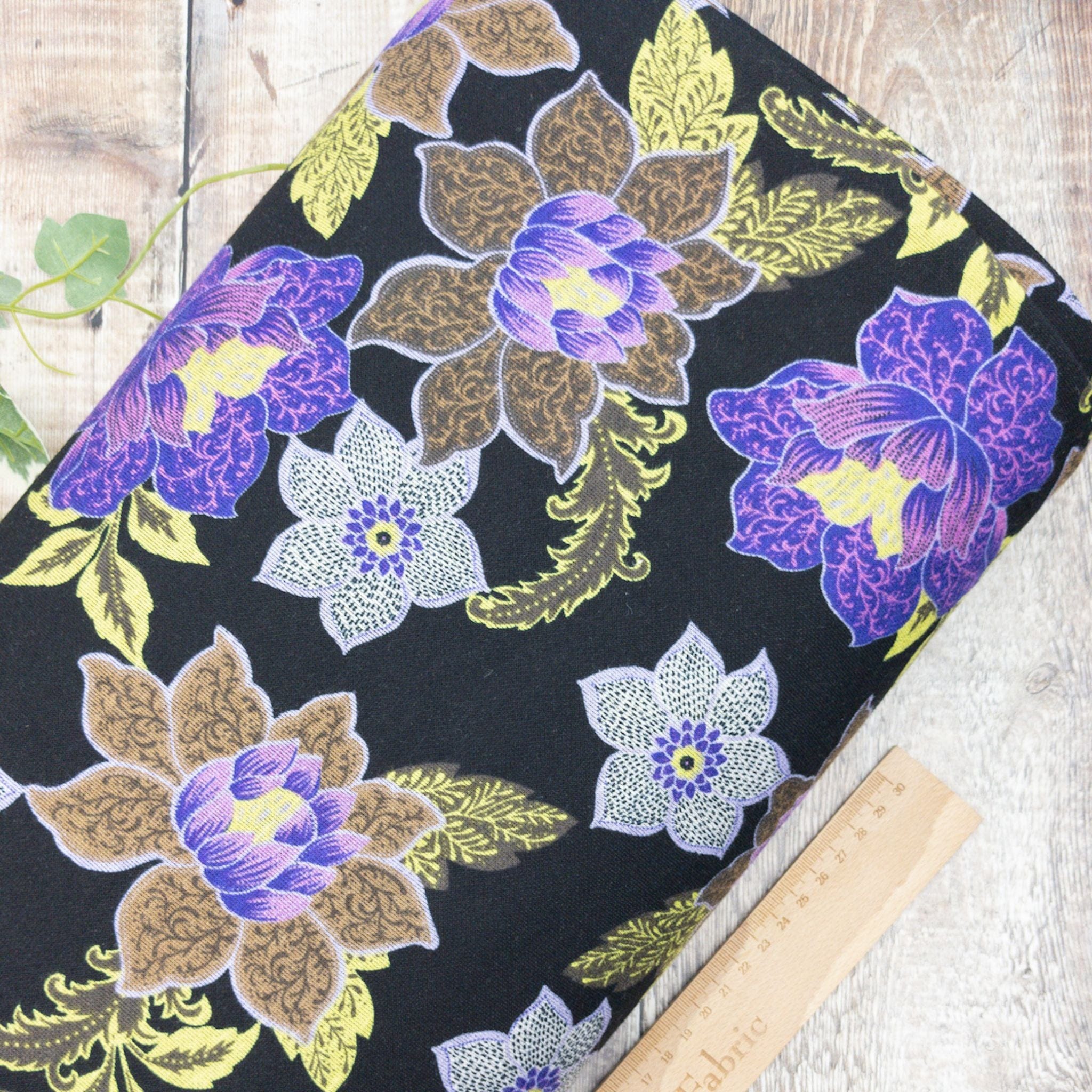 Fabric Black and purple floral double faced punta viscose jersey print