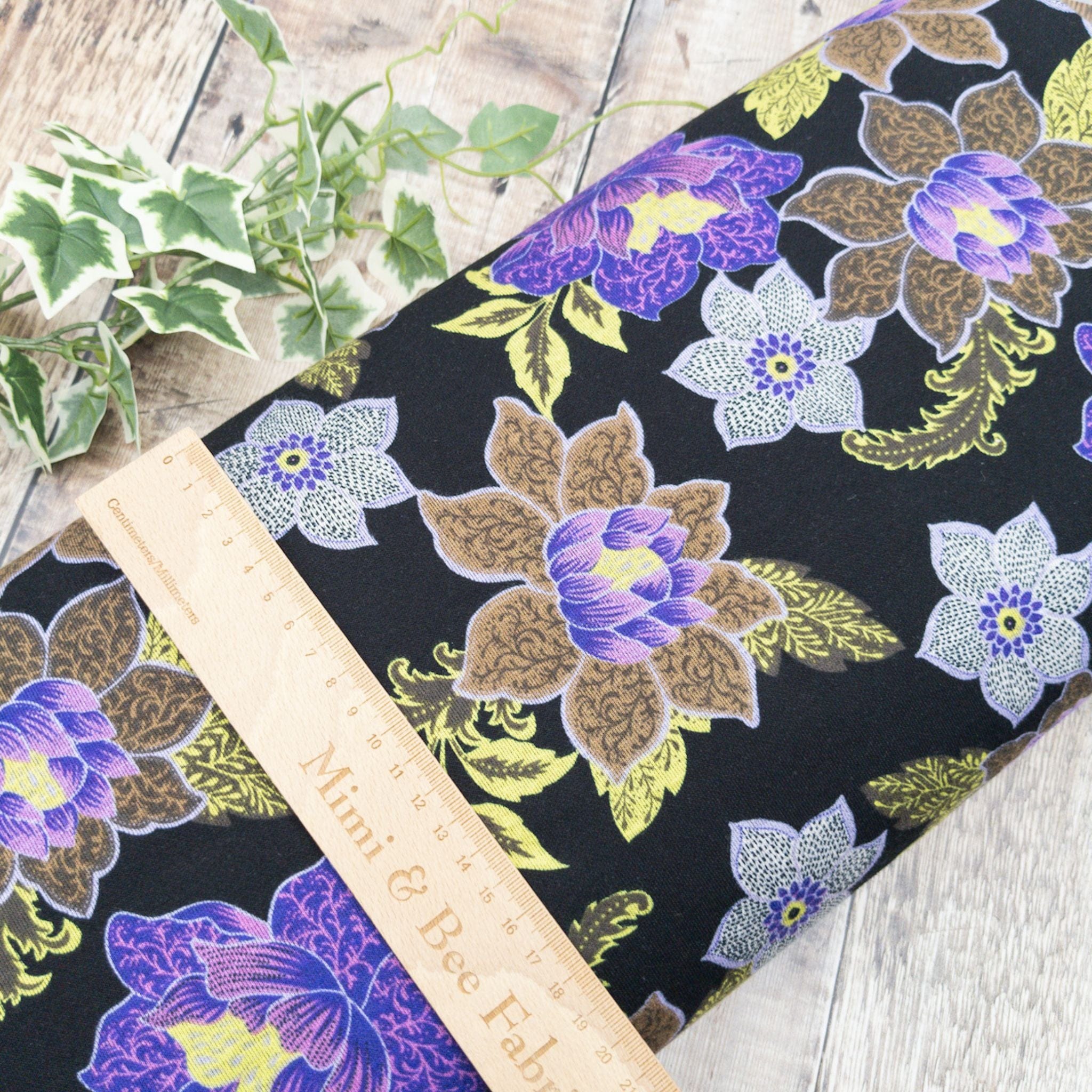 Fabric Black and purple floral double faced punta viscose jersey print