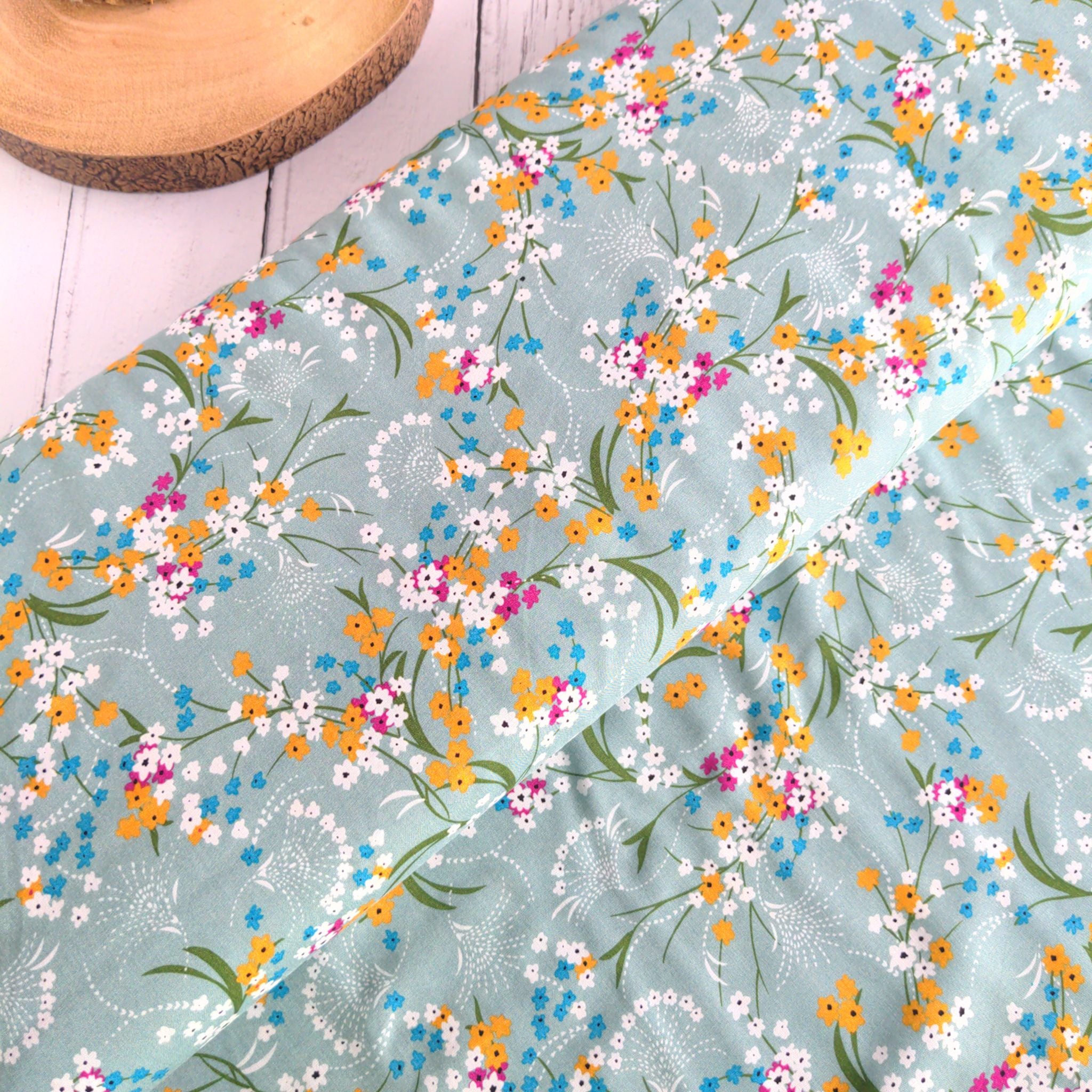 Light green floral viscose dressmaking fabric