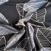 :arge grey leaves on black viscose lycra jersey fabric