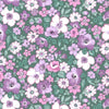 Liberty Heirloom lasenby cotton fabric with delicate purple and white flowers on a green background