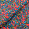 fabric Navy cotton lawn dressmaking fabric with red flowers - Peter Horton