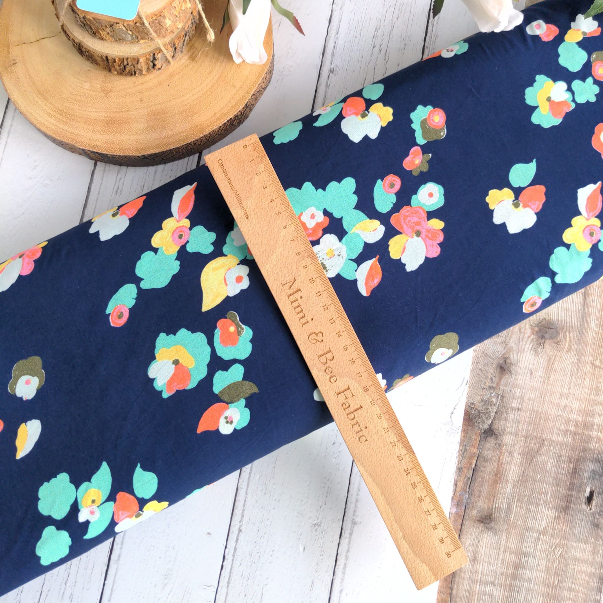 Bright florals on navy ananda viscose fabric