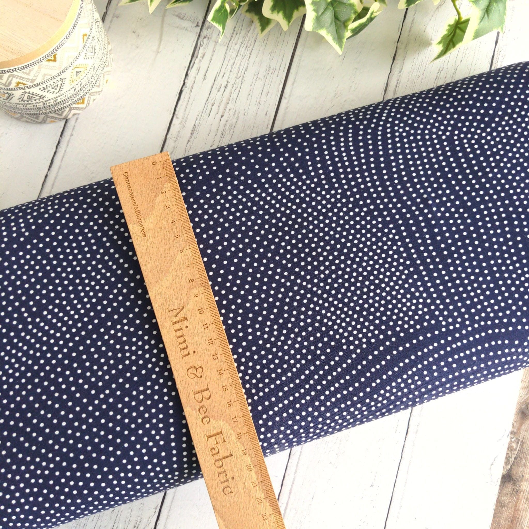 fabric Navy polka dot viscose lycra jersey