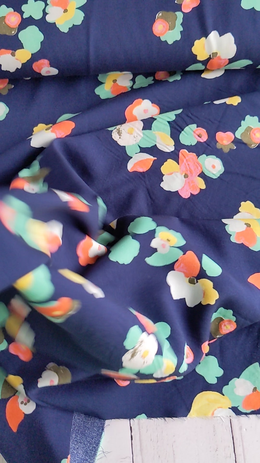 Bright florals on navy ananda viscose fabric