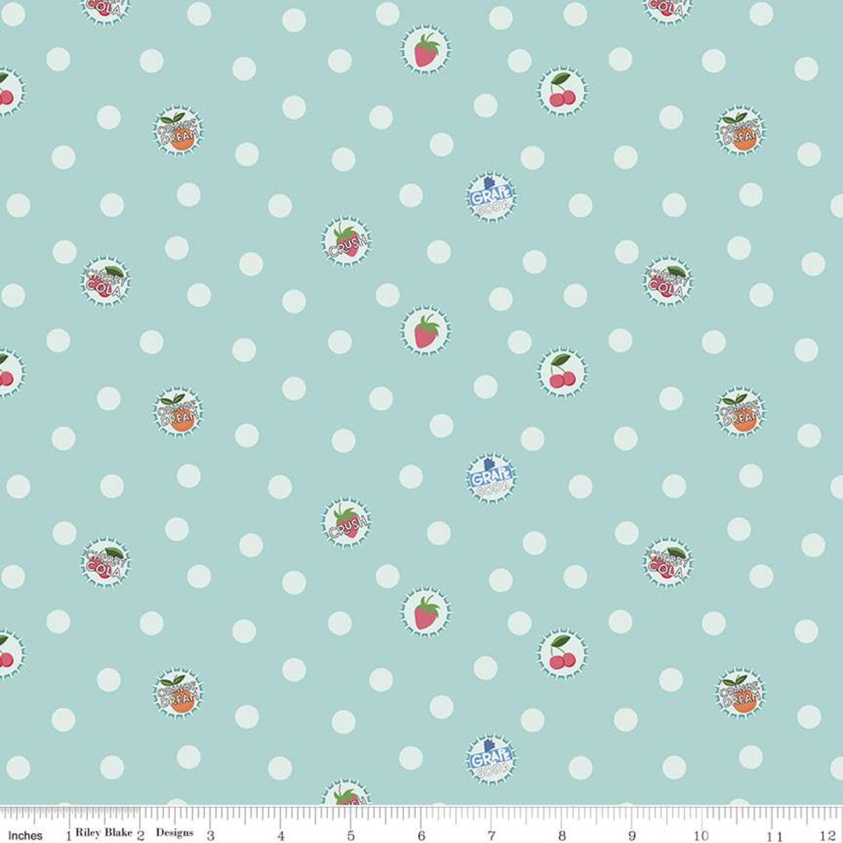 Cute bottlecaps with cherries and strawberries on a green/blue fabric with white polka dots