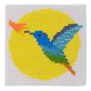 Blue humming bird on a yellow circle of cross stitches. A cross stitch kit from Stitchfinity