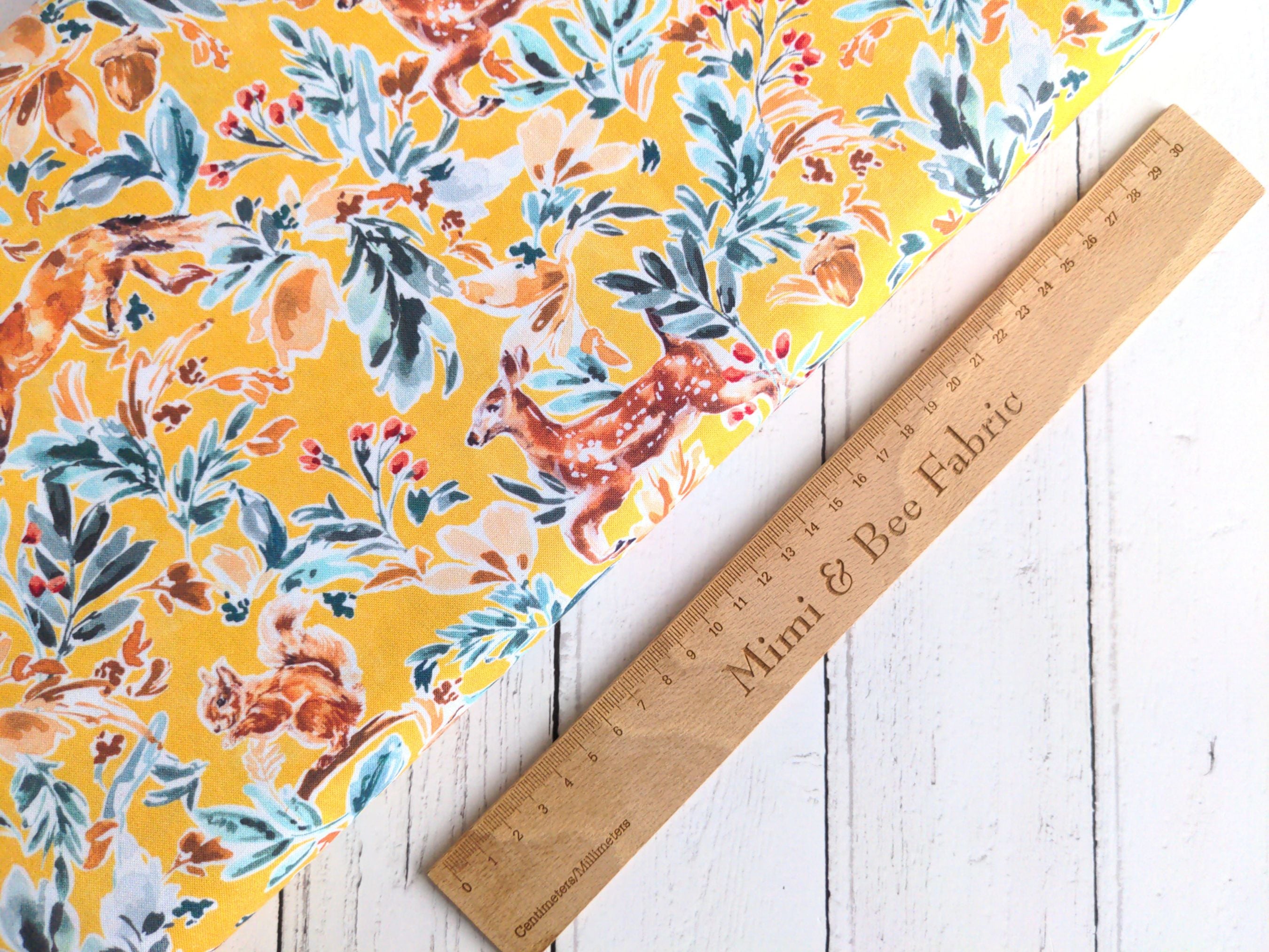 Forest animals and foliage on yellow cotton fabric - Into the wild by Dashwood Studio