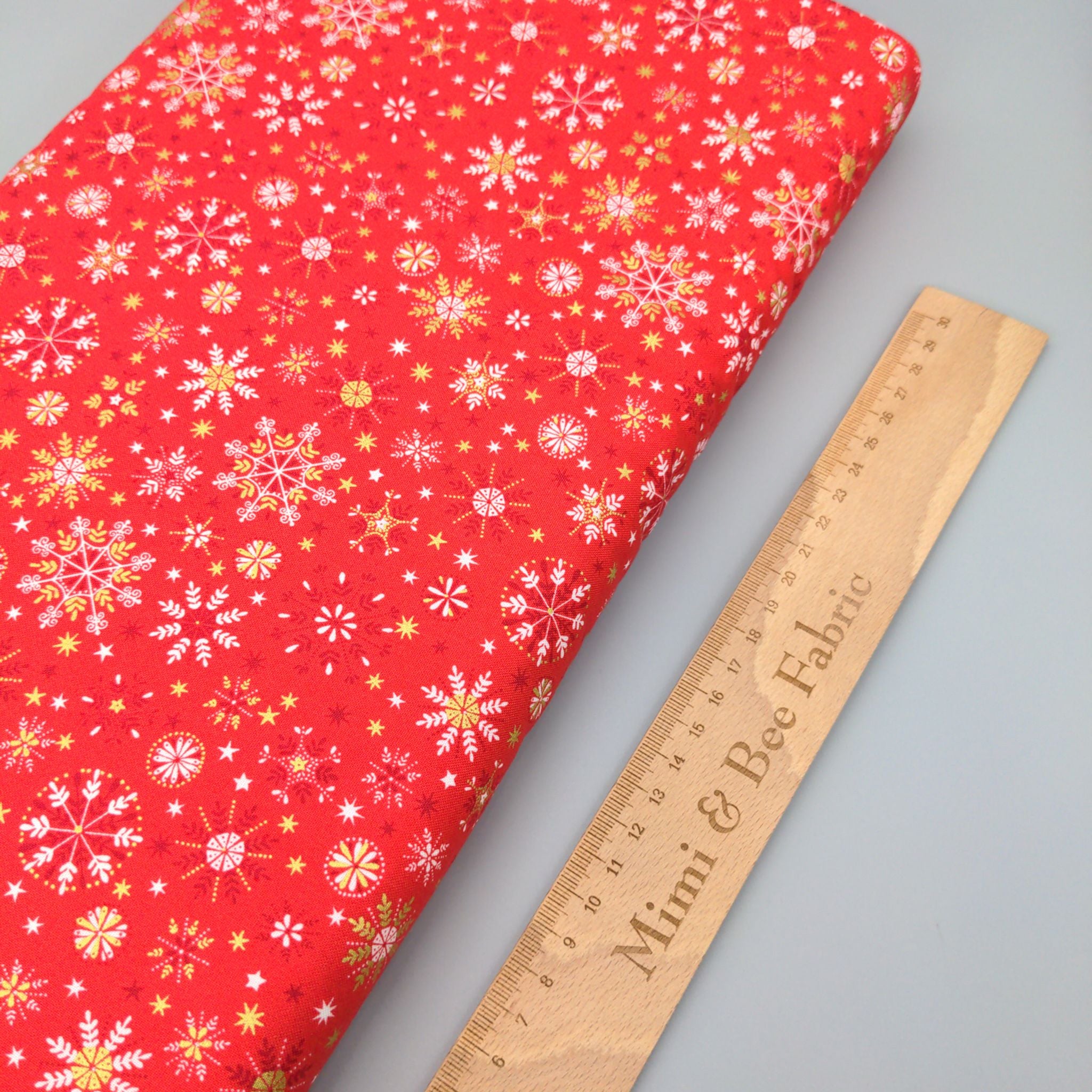 Snowflakes on red cotton fabric - Makower