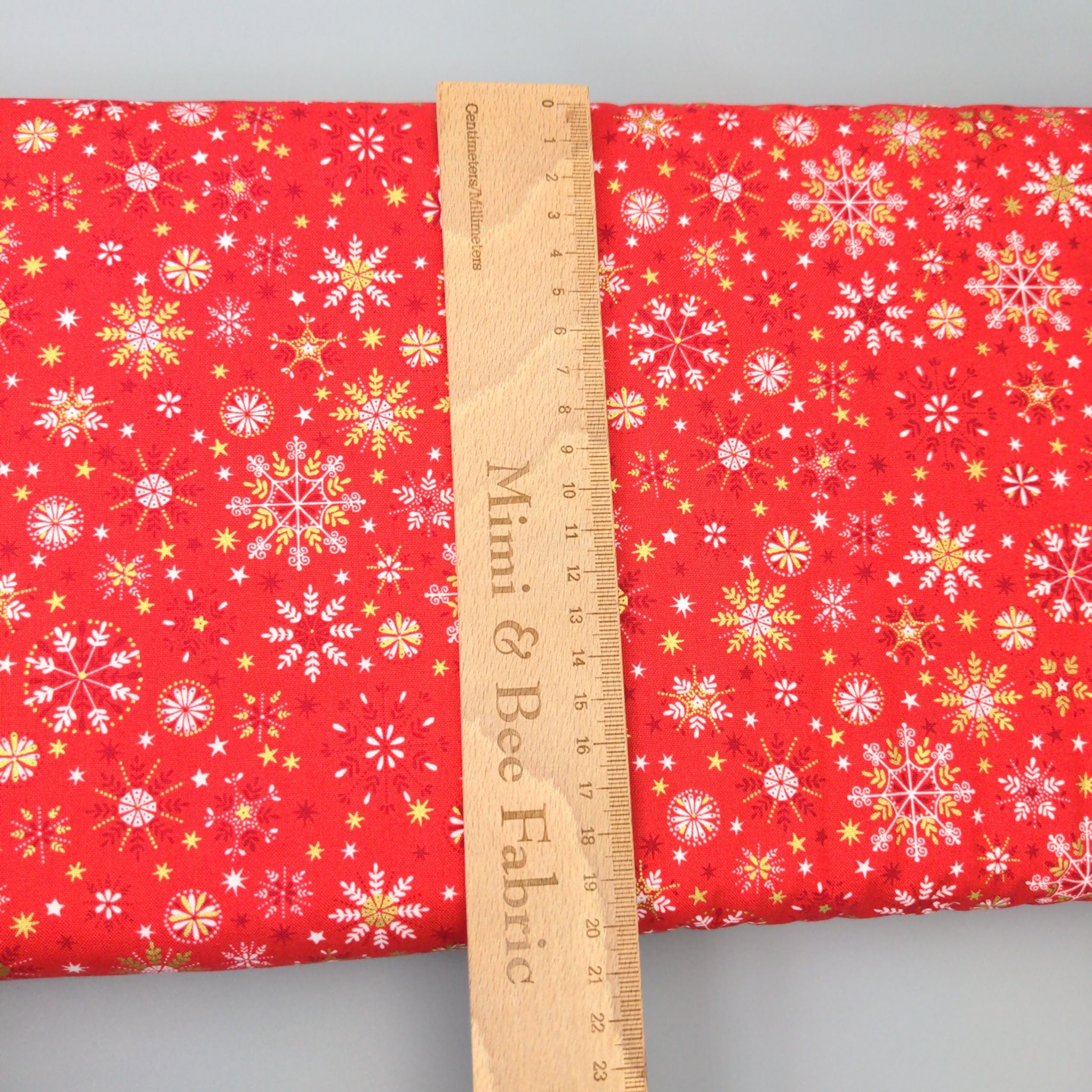 Snowflakes on red cotton fabric - Makower