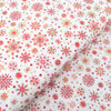Red snowflakes on cream cotton fabric - Makower