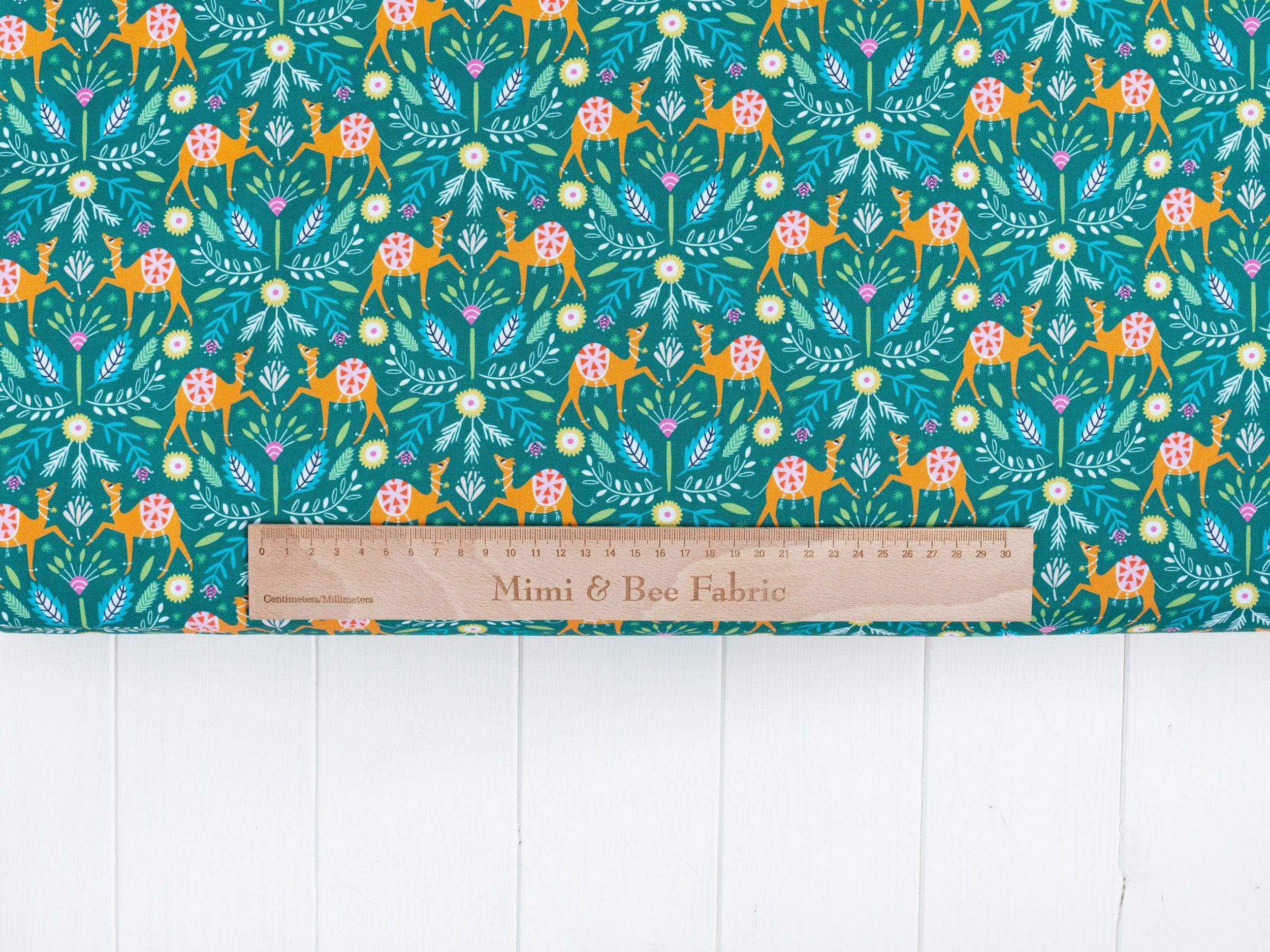 Fabric Camels and floral on green 100% cotton quilting fabric - 'Silk Roads' by Dashwood Studio