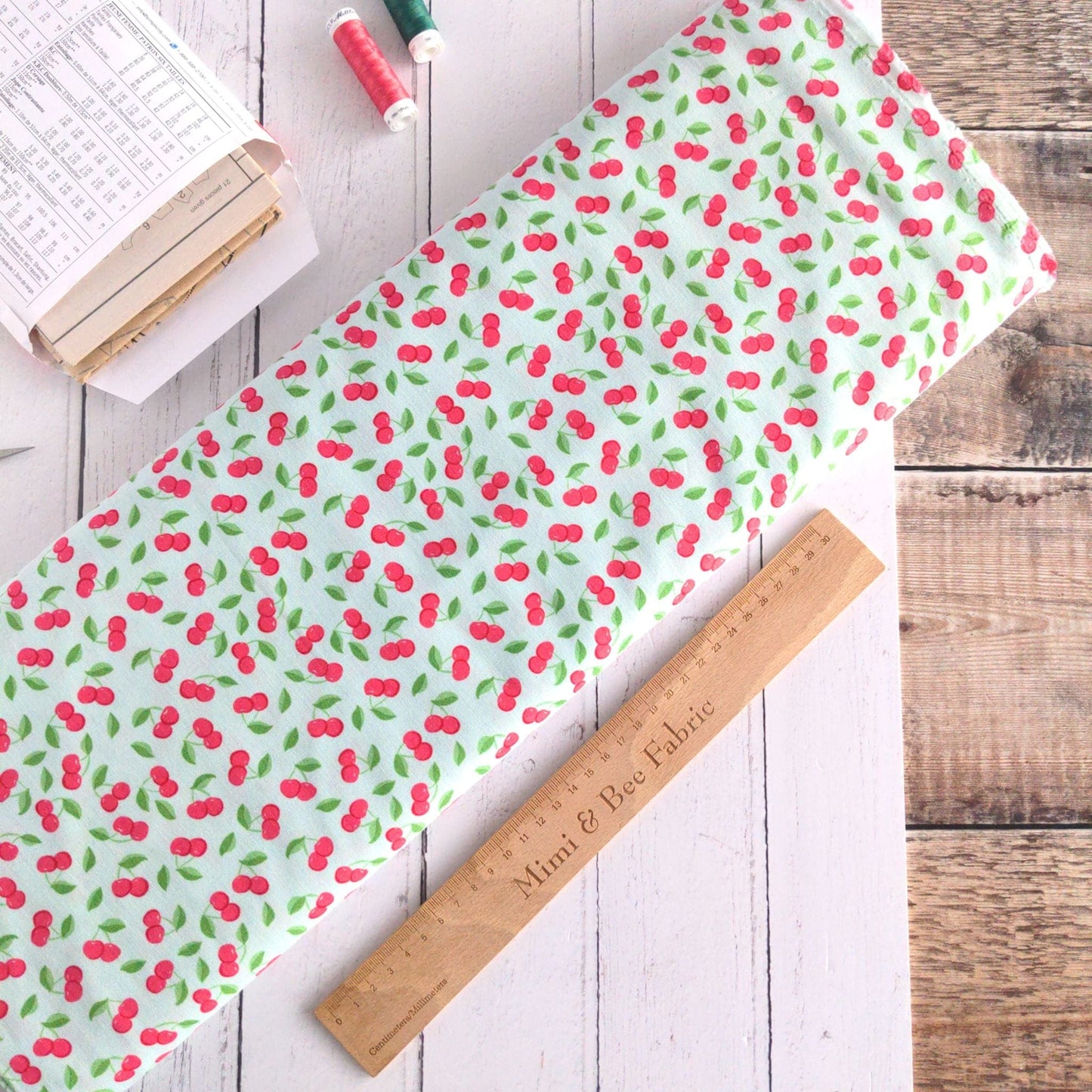Fabric Cherries on green cotton fabric - Bleached Dream Summer Picnic - Riley Blake