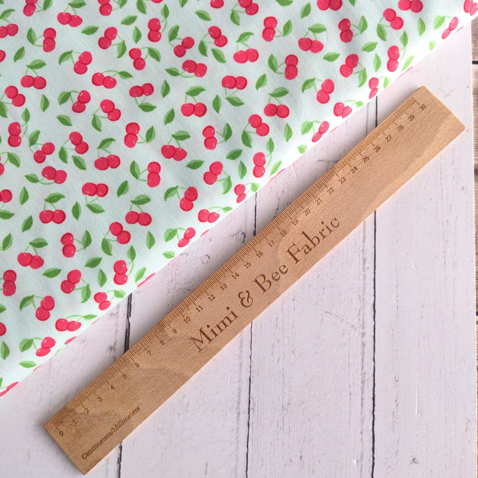 Fabric Cherries on green cotton fabric - Bleached Dream Summer Picnic - Riley Blake