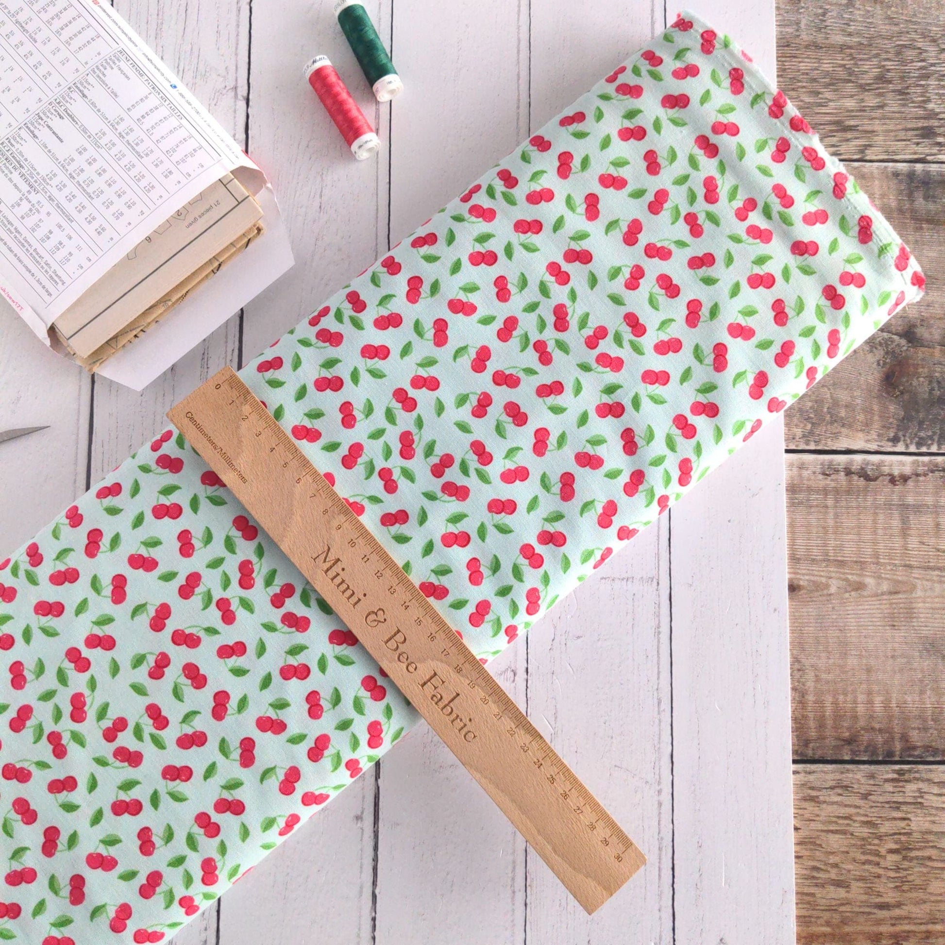 Fabric Cherries on green cotton fabric - Bleached Dream Summer Picnic - Riley Blake