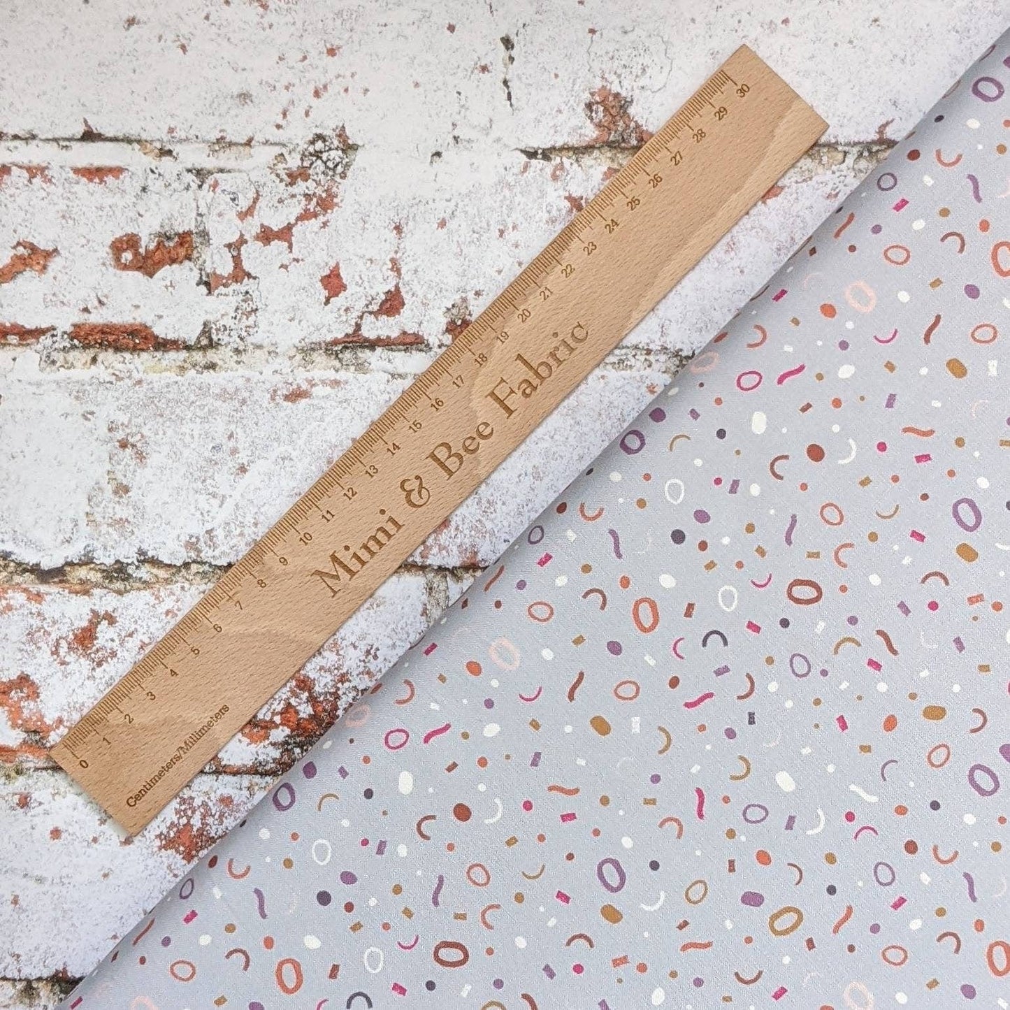 Fabric Confetti on grey cotton fabric - The Dreamer by Lewis & Irene