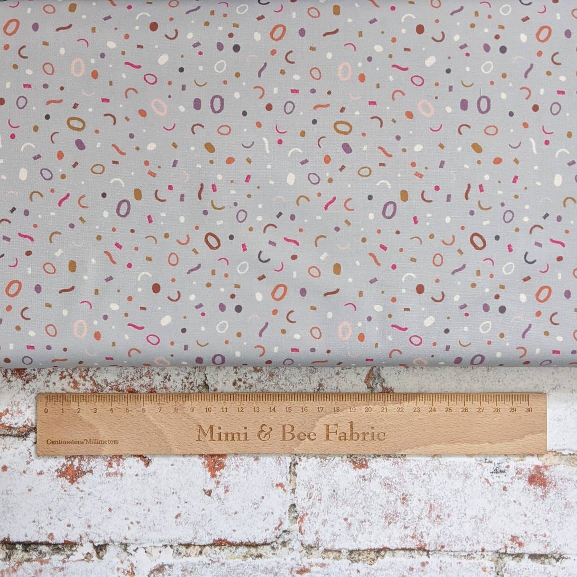 Fabric Confetti on grey cotton fabric - The Dreamer by Lewis & Irene