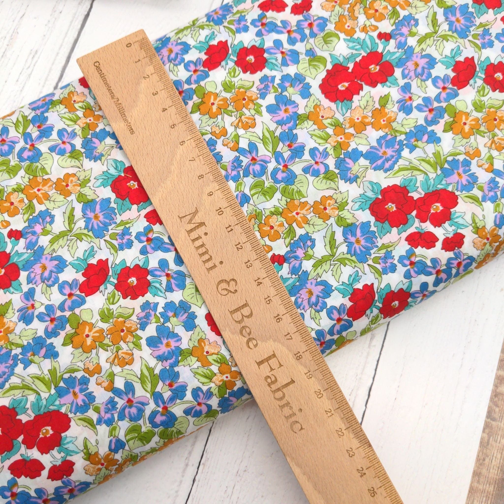 Fabric Cotton lawn dressmaking fabric with red and blue flowers - Peter Horton