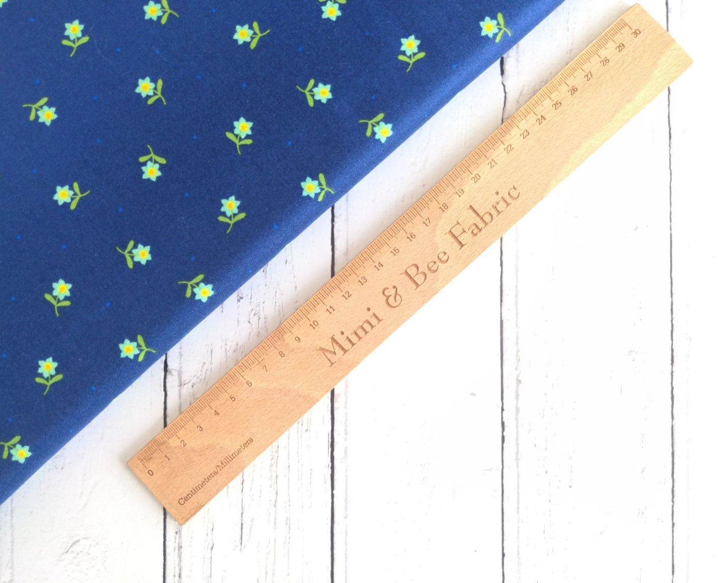 Fabric Daisies on a navy cotton fabric 'Hibiscus Hummingbird'