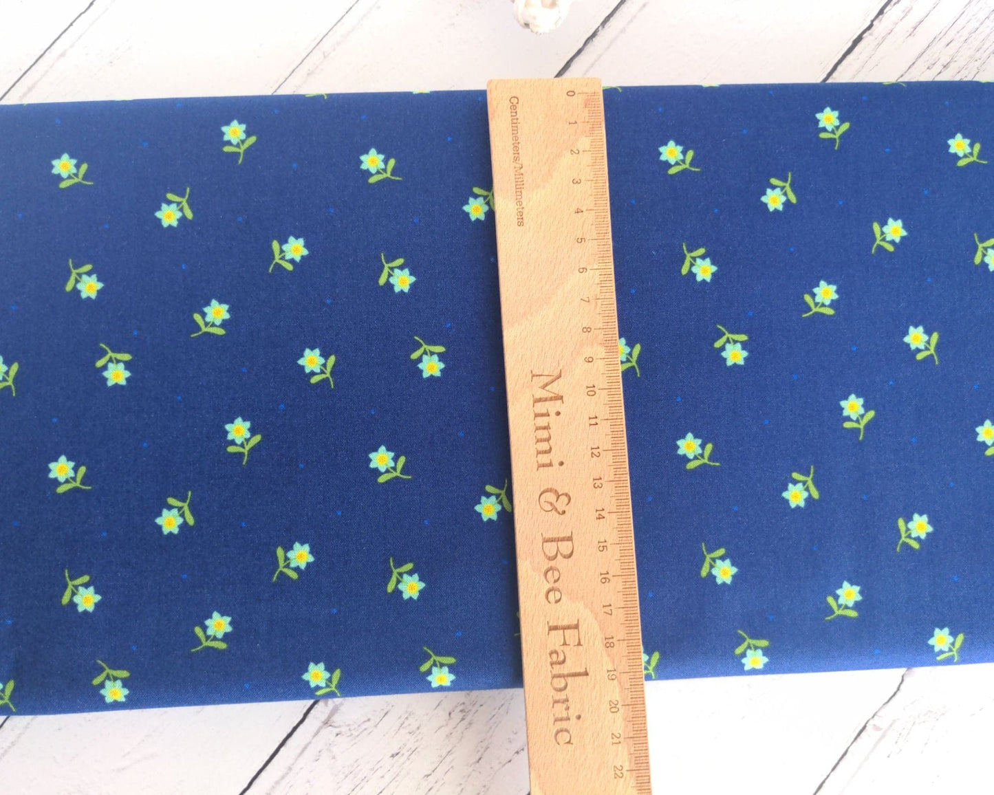 Fabric Daisies on a navy cotton fabric 'Hibiscus Hummingbird'