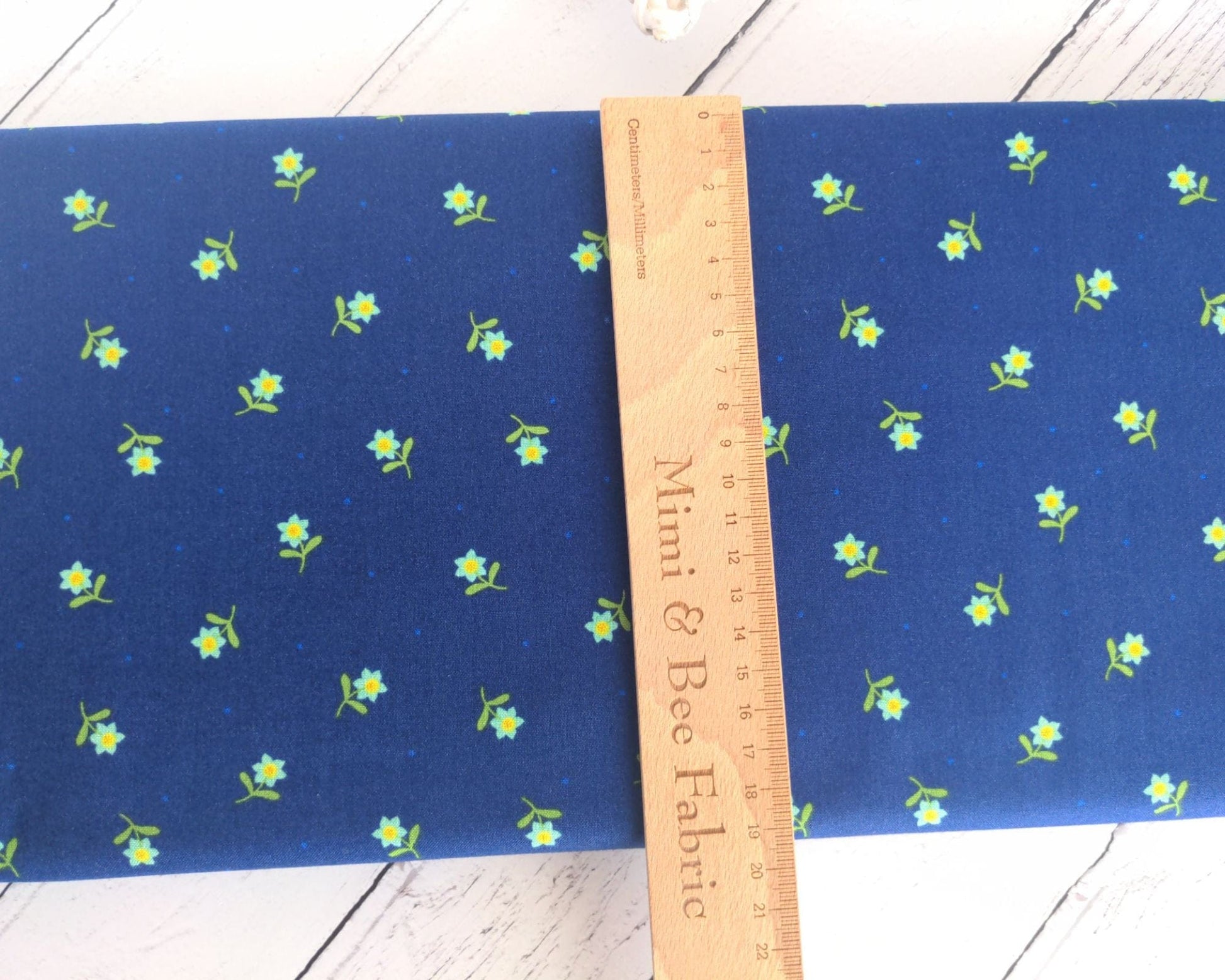 Fabric Daisies on a navy cotton fabric 'Hibiscus Hummingbird'