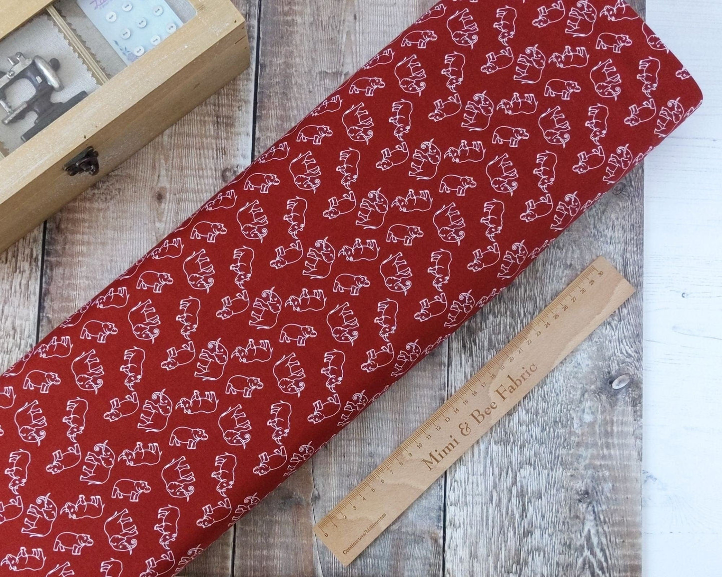 Fabric Elephants, rhinos and hippos on rust wide cotton fabric
