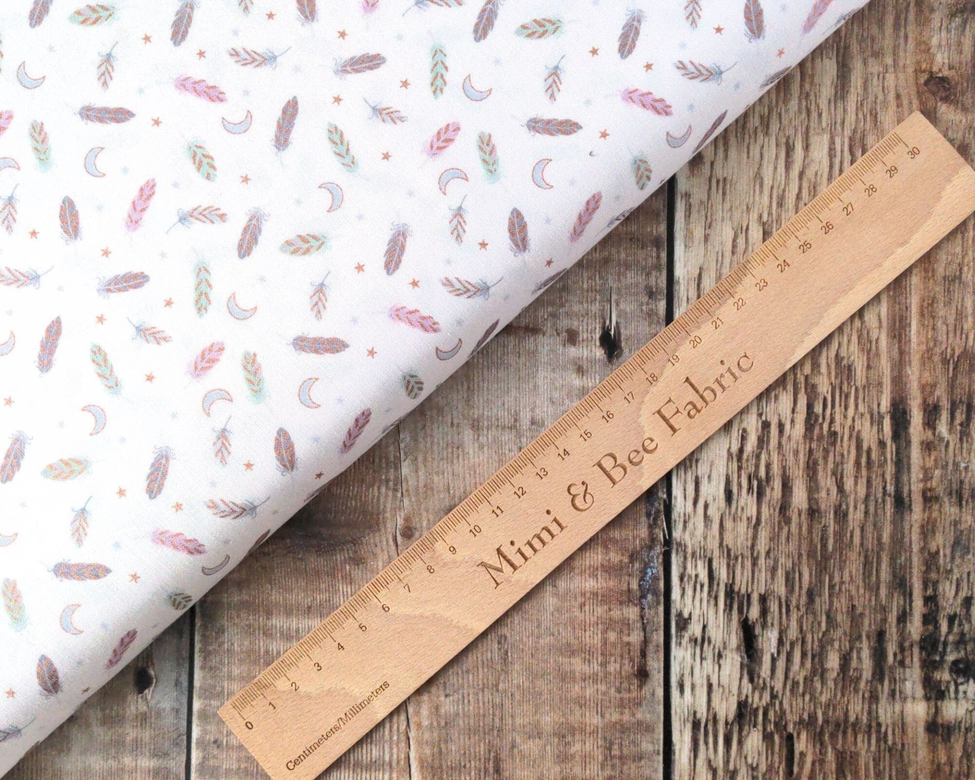 Fabric Feathers and stars on cream cotton fabric - Enchanted by Lewis & Irene