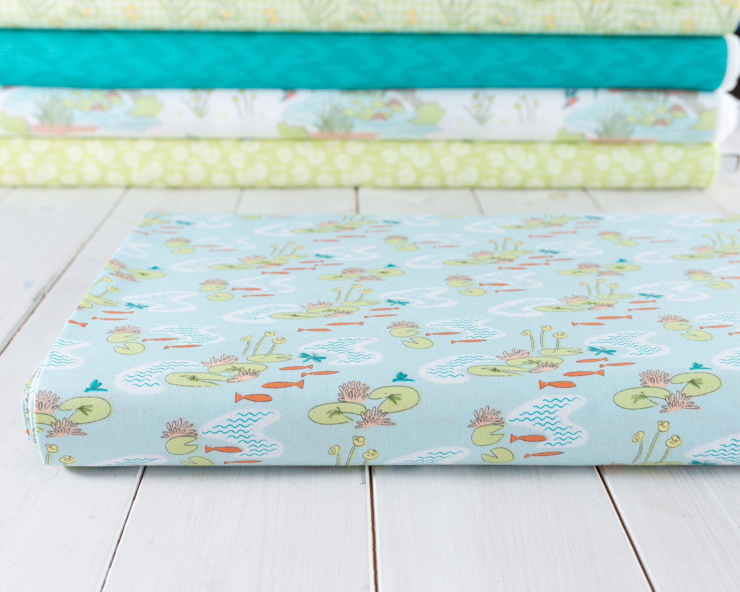 Fabric Fish in the pond on pale green cotton fabric - Craft Cotton Co