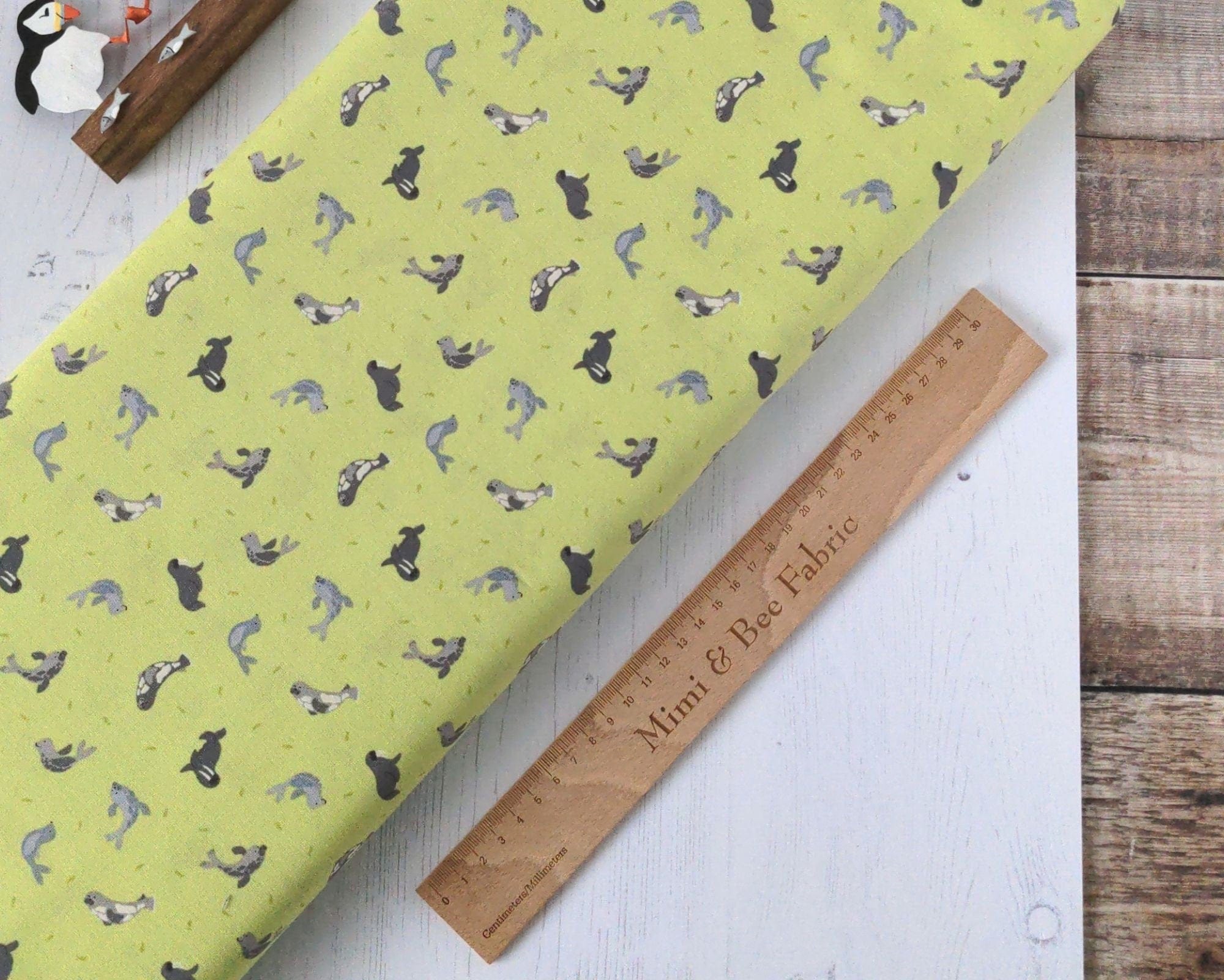 Fabric Grey Seals on lime green cotton fabric - Polar Animals by Lewis & Irene