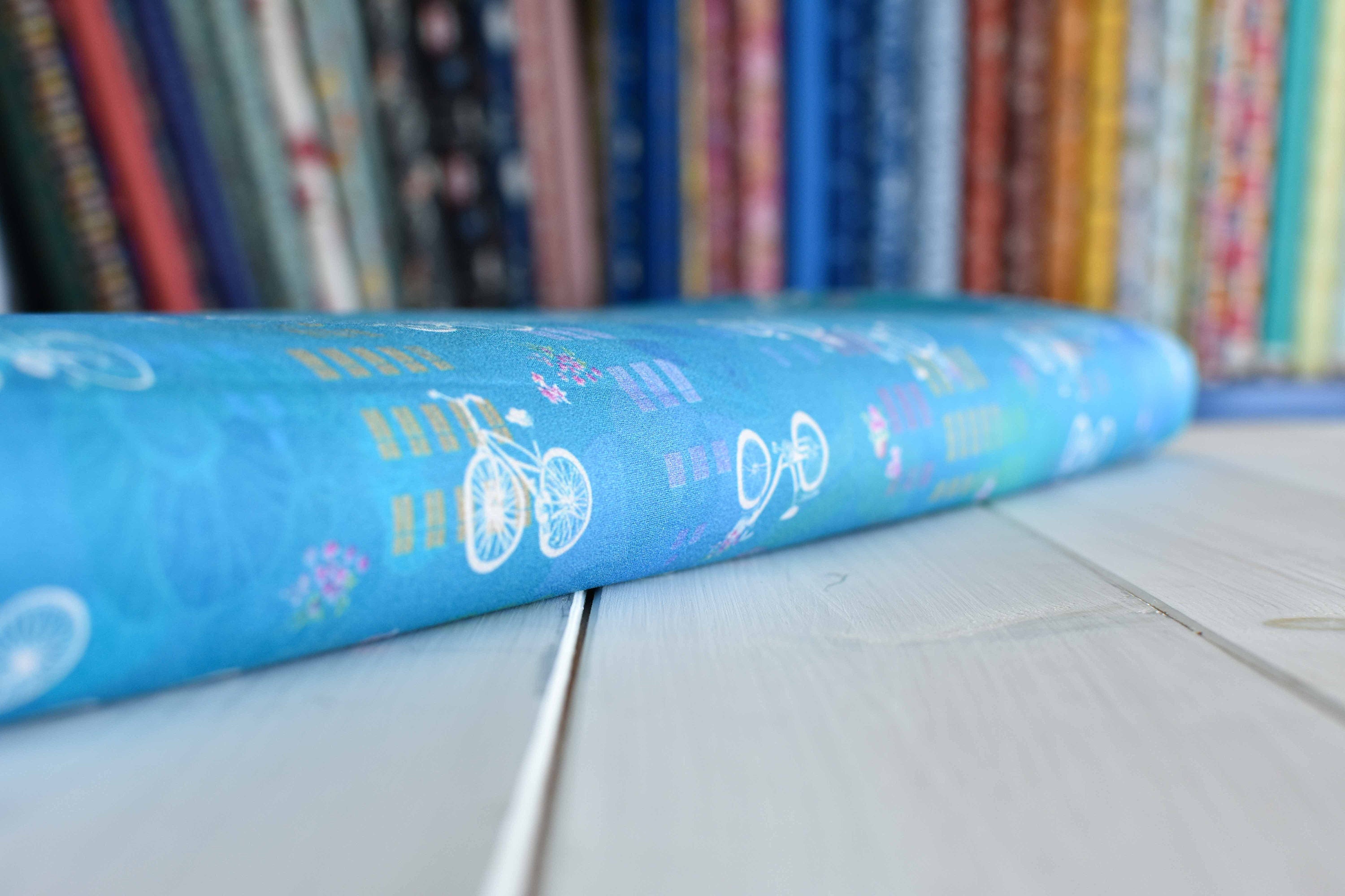 Bicycles on blue cotton fabric - Robert Kaufman