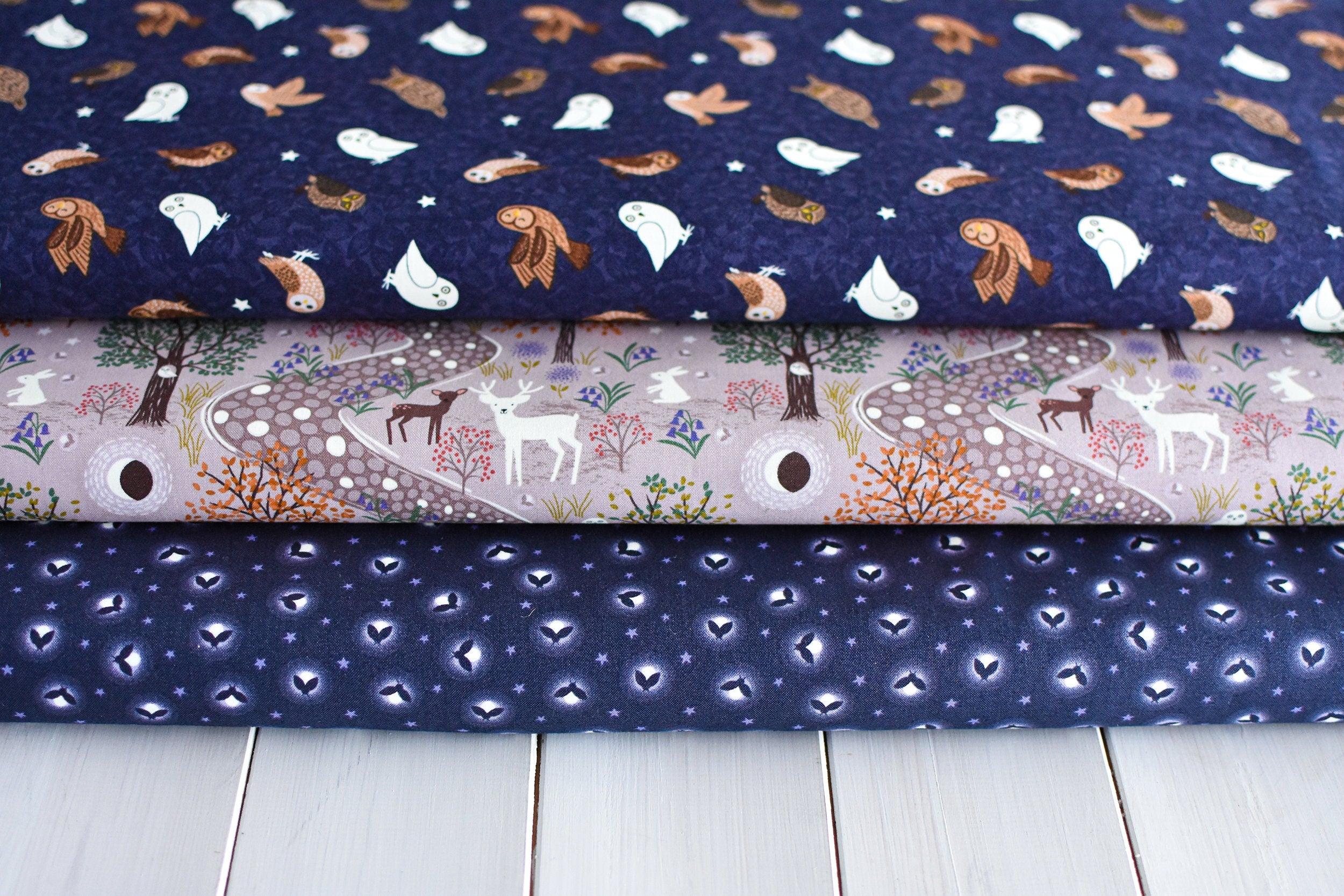 Glow fireflies on dark cotton fabric - 'Bluebell Wood' Lewis & Irene