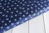 Glow in the dark fireflies on a dark blue cotton fabric - Bluebell Wood by Lewis and Irene