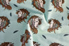 Wild horses with feathers in their manes on a light green organic jersey by Bloome Copenhagen