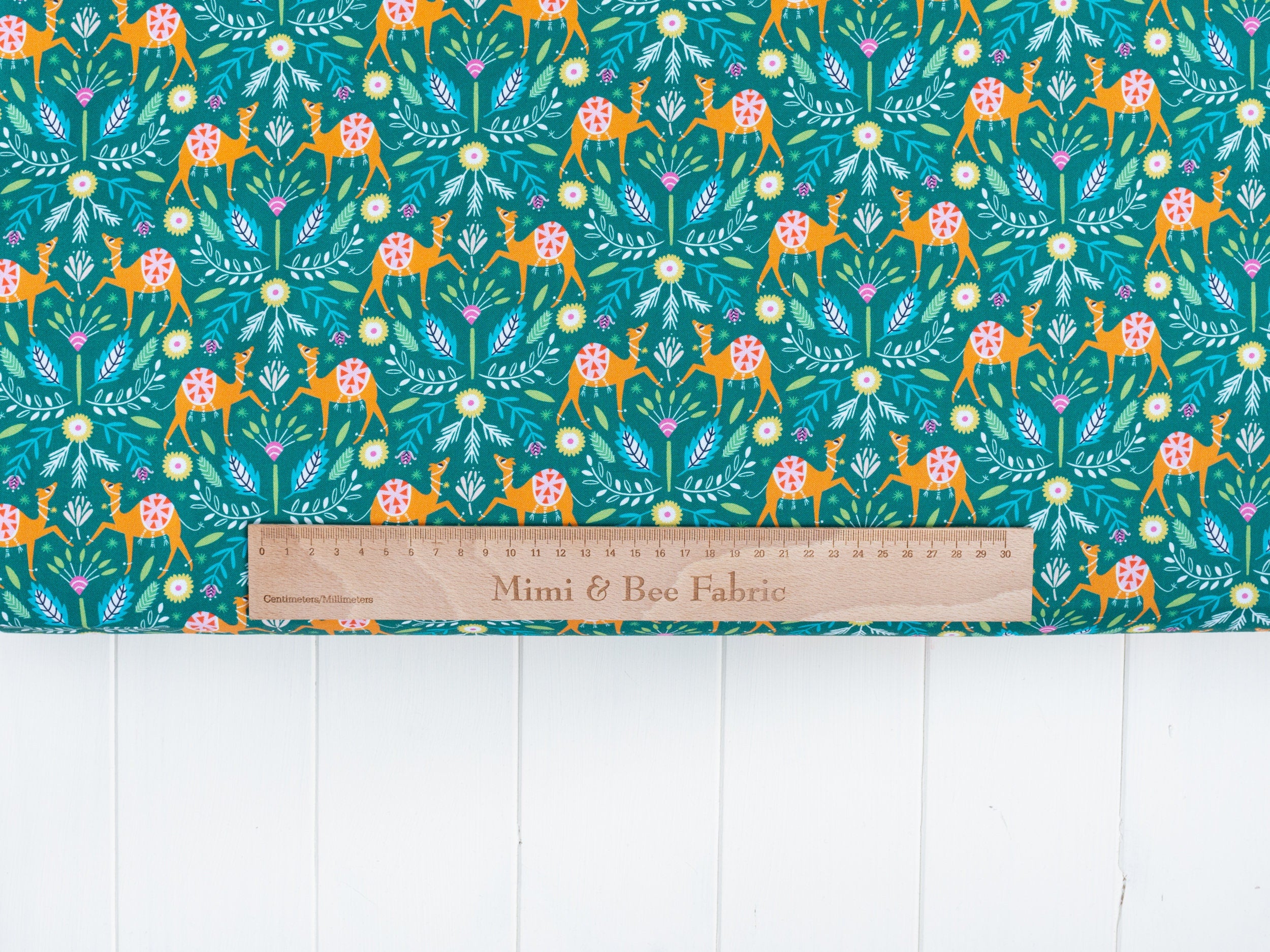 Camels and floral on green 100% cotton quilting fabric - 'Silk Roads' by Dashwood Studio