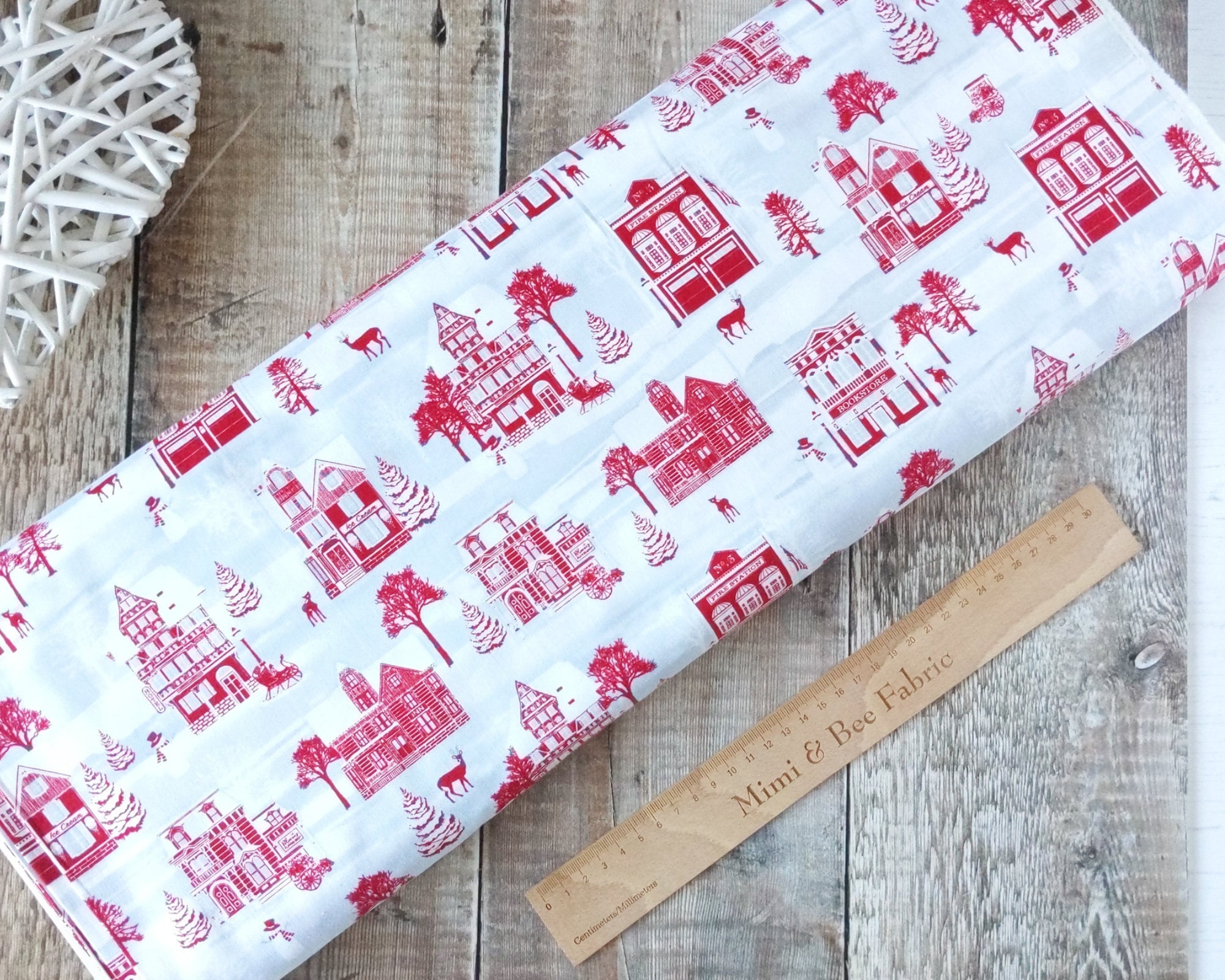 Winter wonderland scene in red on white cotton quilting fabric - Holiday Lane by Henry Glass