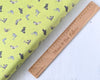 Grey Seals on lime green cotton fabric - Polar Animals by Lewis & Irene