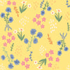 Blue, pink and white spring flowers on bright yellow cotton