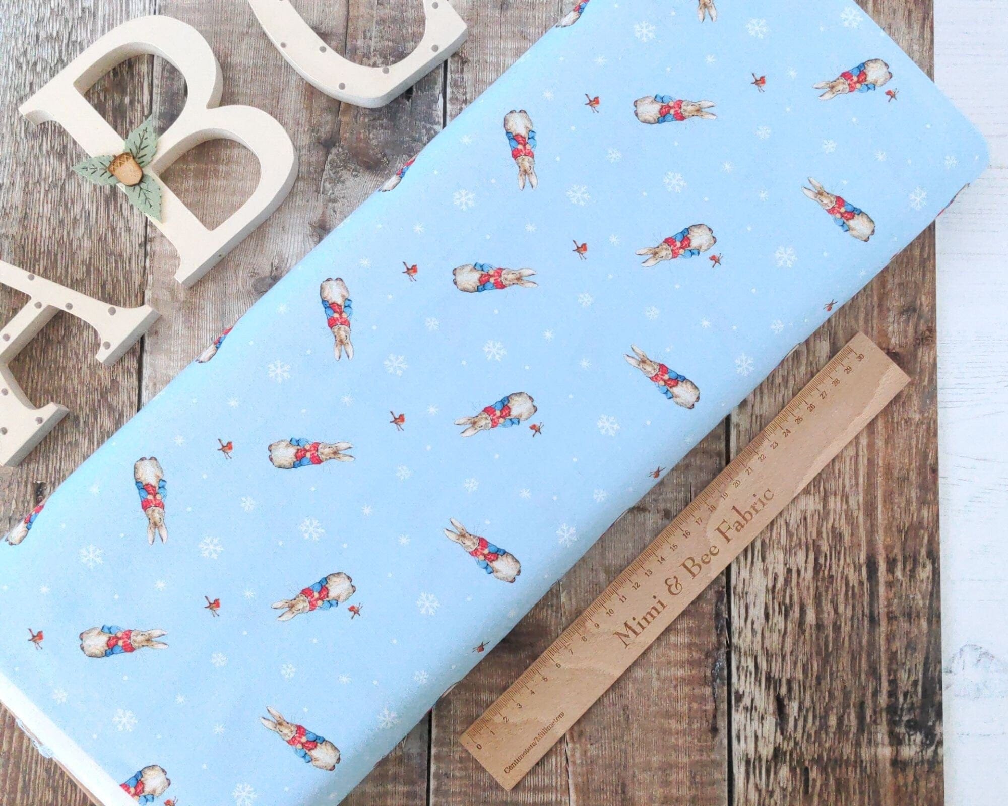 Fabric Peter Rabbit and robin on blue cotton - CraftCottonCo