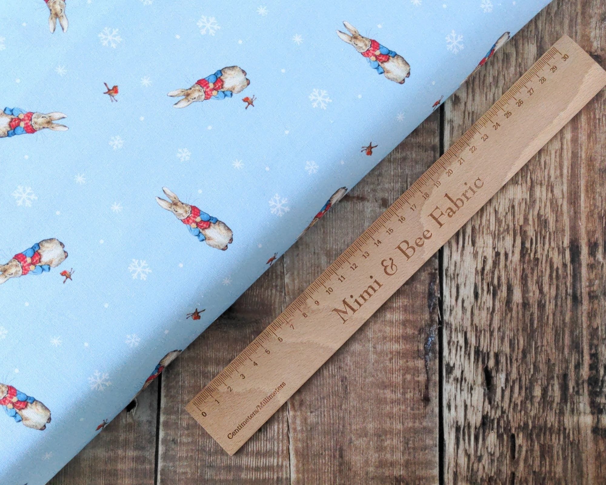 Fabric Peter Rabbit and robin on blue cotton - CraftCottonCo