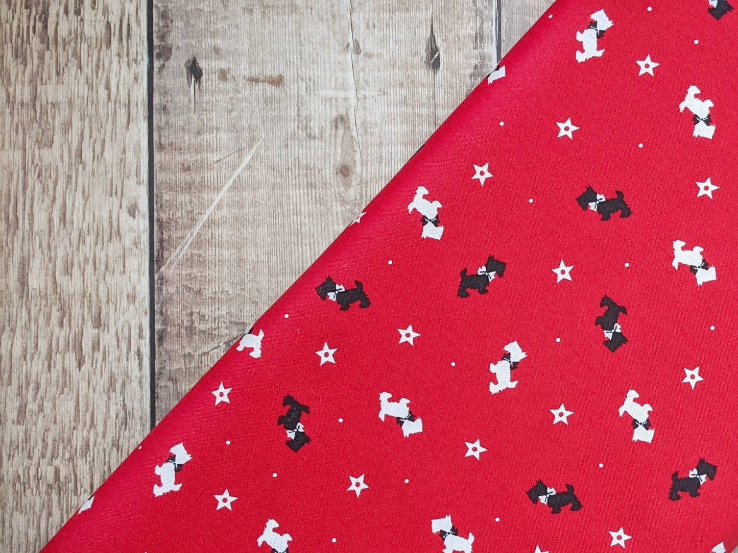 Fabric Scottie Dogs on red winter fabric - V & A Christmas Wishes - Craft Cotton