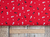 Fabric Scottie Dogs on red winter fabric - V & A Christmas Wishes - Craft Cotton