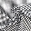 Textured black and white cotton gingham fabric