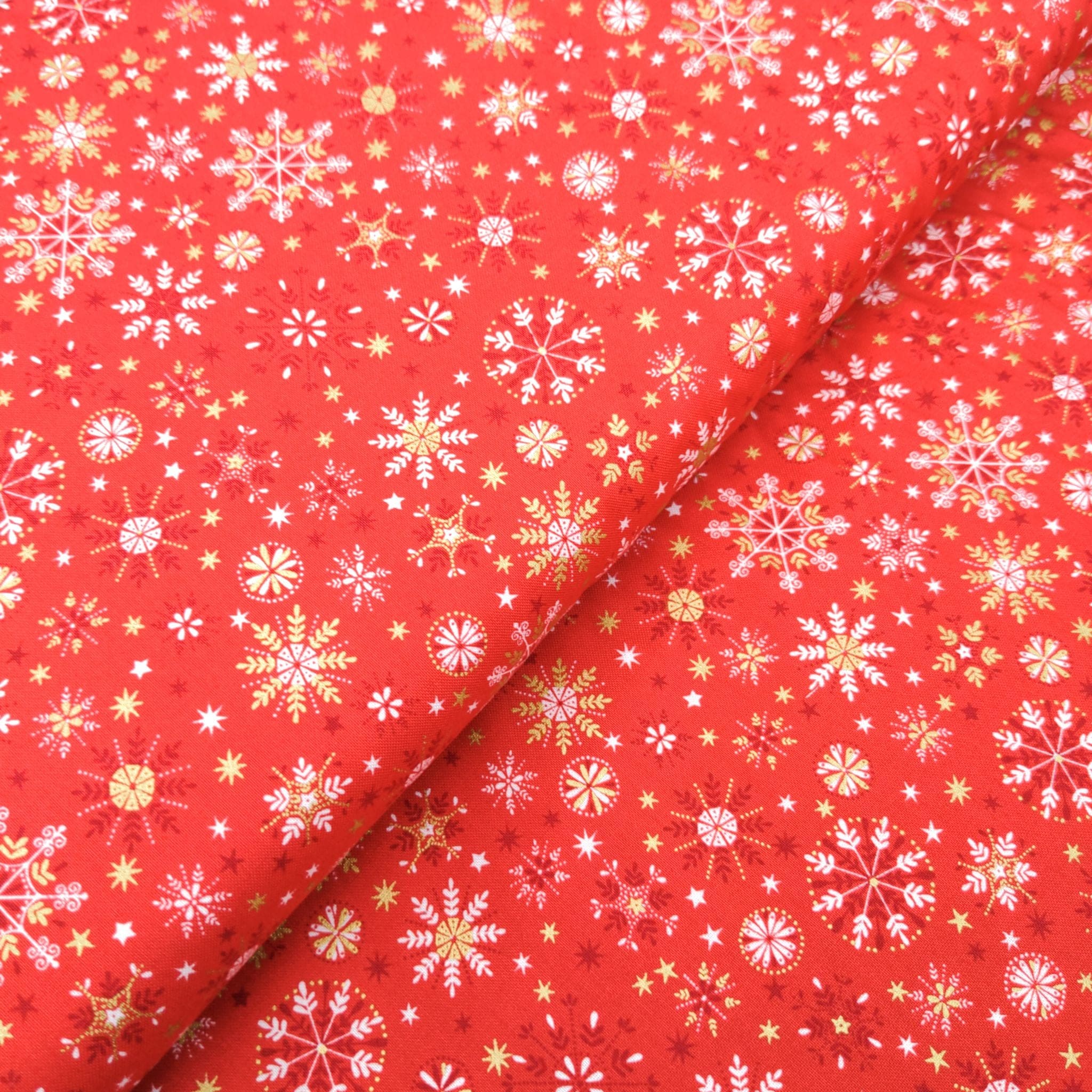 Fabric Snowflakes on red cotton fabric - Makower