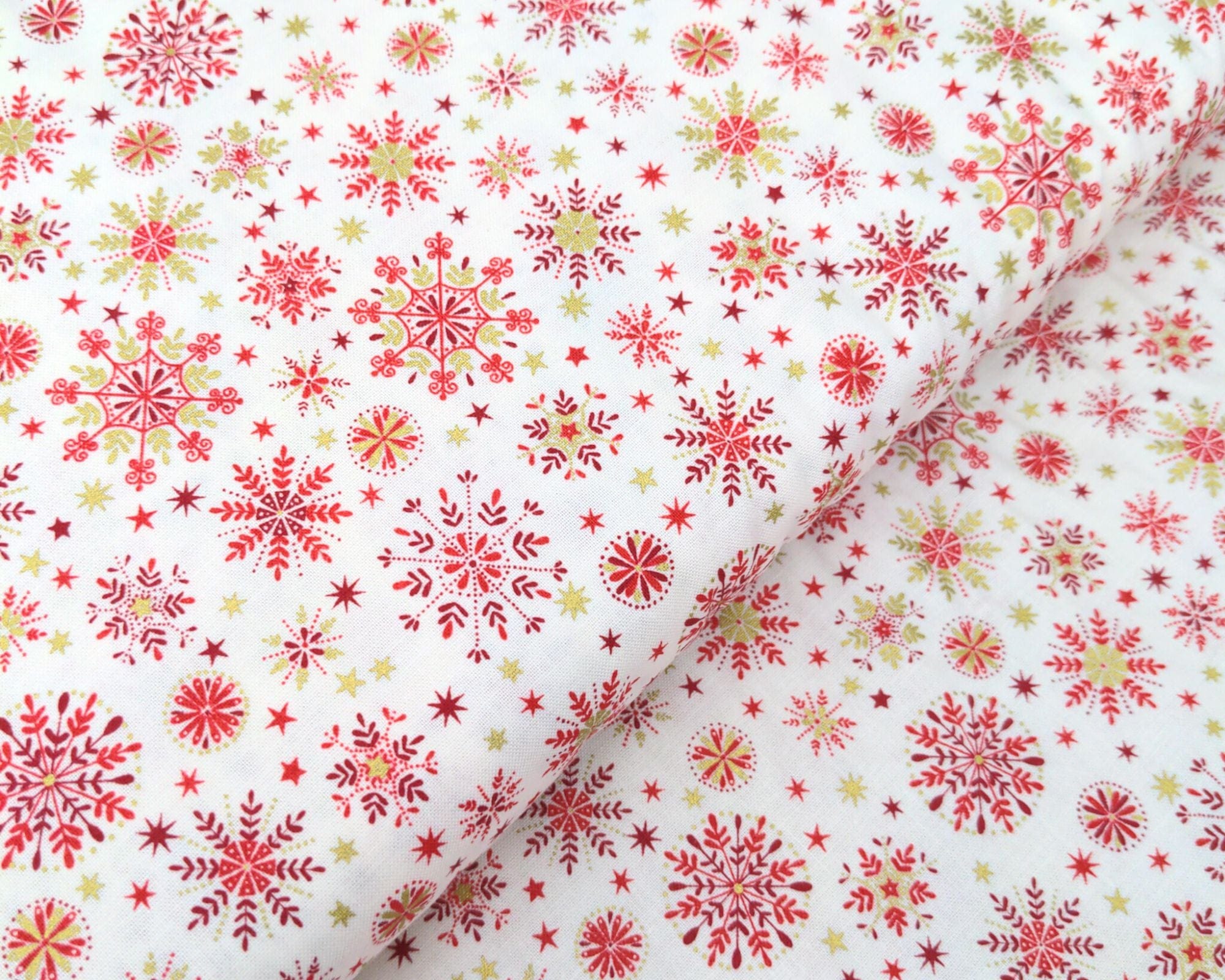 Fabric Snowflakes on red cotton fabric - Makower