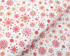 Fabric Snowflakes on red cotton fabric - Makower