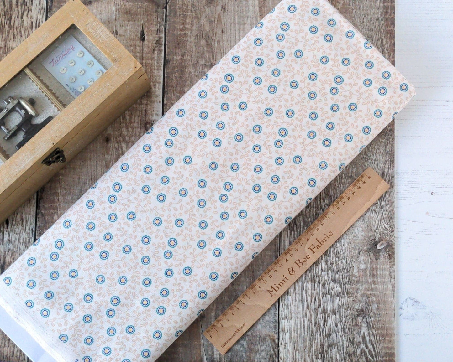 Fabric Turquoise Flowers on Cream 100% cotton fabric - Little Matryoshka by Lewis & Irene